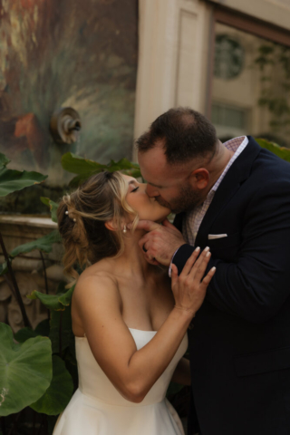 A young bride and groom at the Tarrant County Courthouse on their intimate elopement wedding day in Fort Worth, Texas.