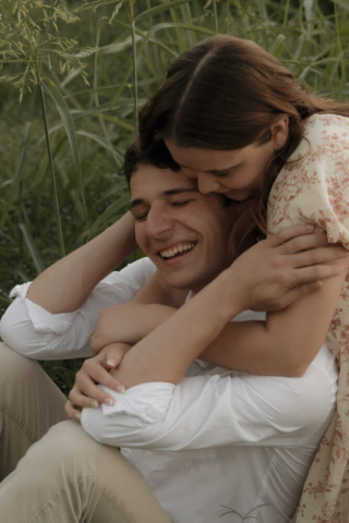 A young couple take their documentary and romantic engagement photos by a Texas DFW cinematic, moody, documentary style photographer.