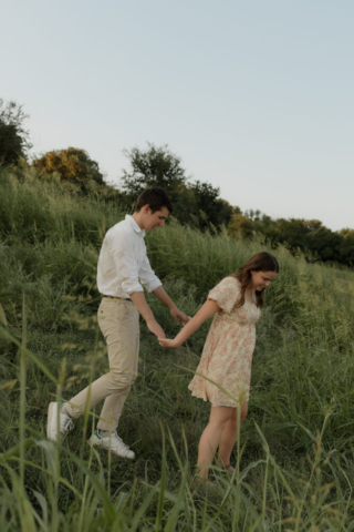 A young couple take their documentary and romantic engagement photos by a Texas DFW cinematic, moody, documentary style photographer.