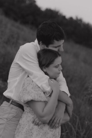 A young couple take their documentary and romantic engagement photos by a Texas DFW cinematic, moody, documentary style photographer.