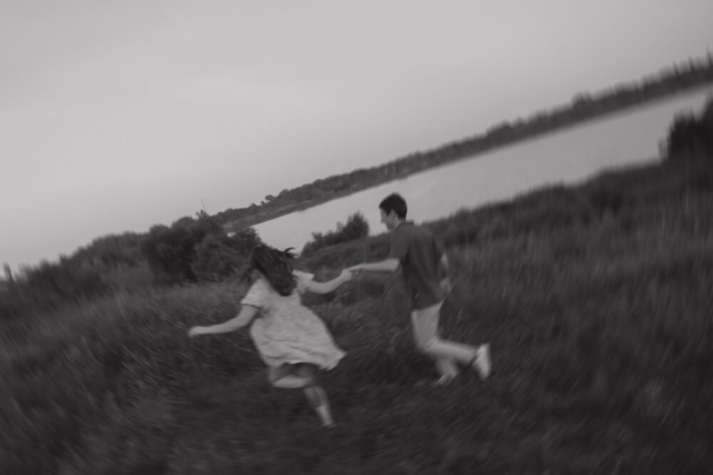 A young couple take their documentary and romantic engagement photos by a Texas DFW cinematic, moody, documentary style photographer.