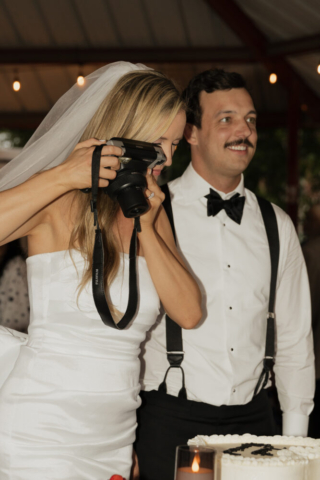 A bride and groom have a candid documentary elopement wedding ceremony in Dallas, Texas, followed by modern classy bridal portraits and candid photos while interacting with their reception guests.