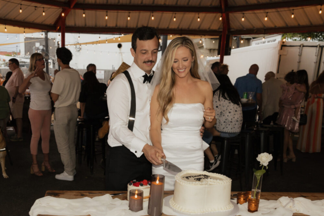 A bride and groom have a candid documentary elopement wedding ceremony in Dallas, Texas, followed by modern classy bridal portraits and candid photos while interacting with their reception guests.