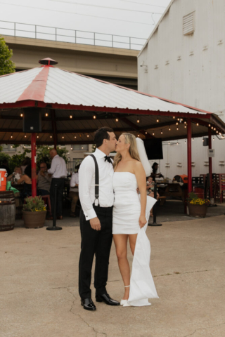 A bride and groom have a candid documentary elopement wedding ceremony in Dallas, Texas, followed by modern classy bridal portraits and candid photos while interacting with their reception guests.