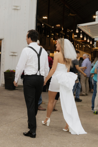 A bride and groom have a candid documentary elopement wedding ceremony in Dallas, Texas, followed by modern classy bridal portraits and candid photos while interacting with their reception guests.