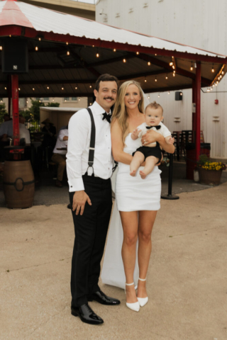 A bride and groom have a candid documentary elopement wedding ceremony in Dallas, Texas, followed by modern classy bridal portraits and candid photos while interacting with their reception guests.