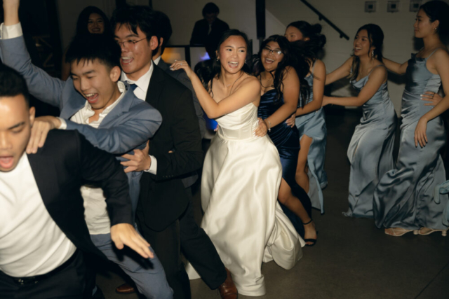 A bride and groom have a candid documentary elopement wedding ceremony in Houston, Texas at the Addison Woods Wedding Venue followed by modern classy bridal portraits and candid photos while interacting with their reception guests.