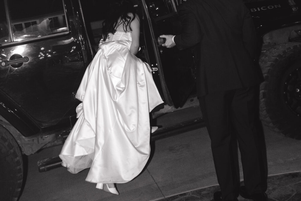A bride and groom have a candid documentary elopement wedding ceremony in Houston, Texas at the Addison Woods Wedding Venue followed by modern classy bridal portraits and candid photos while interacting with their reception guests.