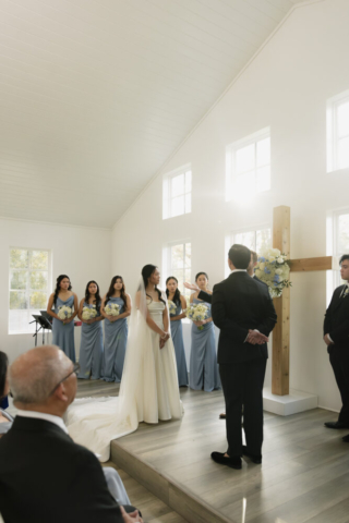 A bride and groom have a candid documentary elopement wedding ceremony in Houston, Texas at the Addison Woods Wedding Venue followed by modern classy bridal portraits and candid photos while interacting with their reception guests.