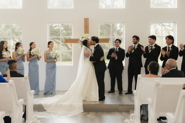 A bride and groom have a candid documentary elopement wedding ceremony in Houston, Texas at the Addison Woods Wedding Venue followed by modern classy bridal portraits and candid photos while interacting with their reception guests.