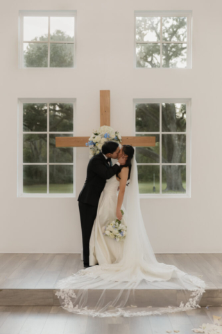 A bride and groom have a candid documentary elopement wedding ceremony in Houston, Texas at the Addison Woods Wedding Venue followed by modern classy bridal portraits and candid photos while interacting with their reception guests.