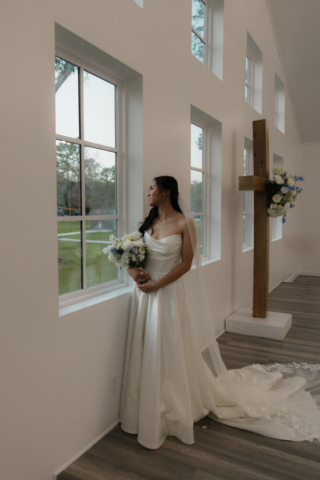 A bride and groom have a candid documentary elopement wedding ceremony in Houston, Texas at the Addison Woods Wedding Venue followed by modern classy bridal portraits and candid photos while interacting with their reception guests.