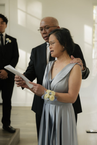 A bride and groom have a candid documentary elopement wedding ceremony in Houston, Texas at the Addison Woods Wedding Venue followed by modern classy bridal portraits and candid photos while interacting with their reception guests.