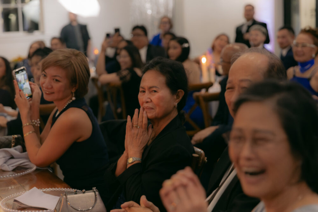 A bride and groom have a candid documentary elopement wedding ceremony in Houston, Texas at the Addison Woods Wedding Venue followed by modern classy bridal portraits and candid photos while interacting with their reception guests.