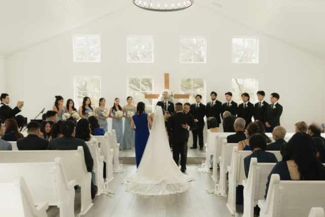 A bride and groom have a candid documentary elopement wedding ceremony in Houston, Texas at the Addison Woods Wedding Venue followed by modern classy bridal portraits and candid photos while interacting with their reception guests.