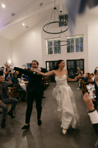 A bride and groom have a candid documentary elopement wedding ceremony in Houston, Texas at the Addison Woods Wedding Venue followed by modern classy bridal portraits and candid photos while interacting with their reception guests.