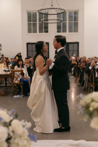 A bride and groom have a candid documentary elopement wedding ceremony in Houston, Texas at the Addison Woods Wedding Venue followed by modern classy bridal portraits and candid photos while interacting with their reception guests.