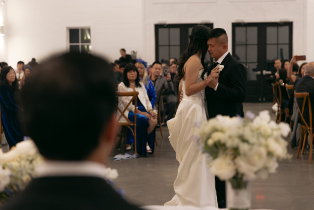 A bride and groom have a candid documentary elopement wedding ceremony in Houston, Texas at the Addison Woods Wedding Venue followed by modern classy bridal portraits and candid photos while interacting with their reception guests.