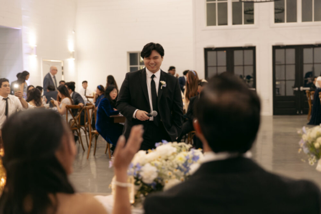 A bride and groom have a candid documentary elopement wedding ceremony in Houston, Texas at the Addison Woods Wedding Venue followed by modern classy bridal portraits and candid photos while interacting with their reception guests.