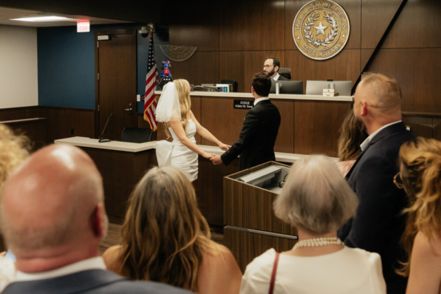 A bride and groom have a candid documentary elopement wedding ceremony in Dallas, Texas, followed by modern classy bridal portraits and candid photos while interacting with their reception guests.