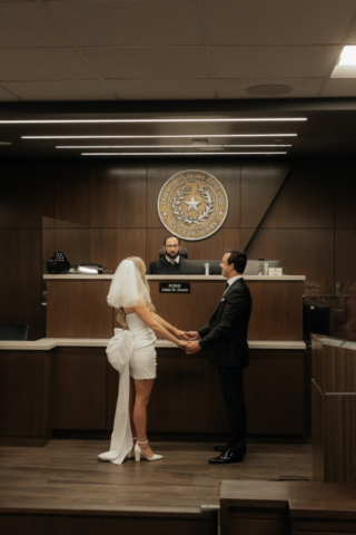 A bride and groom have a candid documentary elopement wedding ceremony in Dallas, Texas, followed by modern classy bridal portraits and candid photos while interacting with their reception guests.