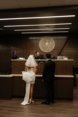 A bride and groom have a candid documentary elopement wedding ceremony in Dallas, Texas, followed by modern classy bridal portraits and candid photos while interacting with their reception guests.