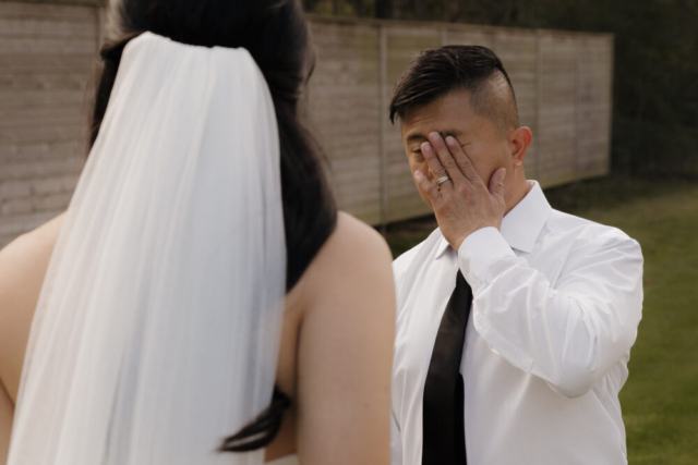 A bride and groom have a candid documentary elopement wedding ceremony in Houston, Texas at the Addison Woods Wedding Venue followed by modern classy bridal portraits and candid photos while interacting with their reception guests.