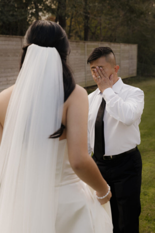 A bride and groom have a candid documentary elopement wedding ceremony in Houston, Texas at the Addison Woods Wedding Venue followed by modern classy bridal portraits and candid photos while interacting with their reception guests.