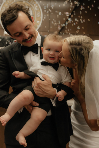 A bride and groom have a candid documentary elopement wedding ceremony in Dallas, Texas, followed by modern classy bridal portraits and candid photos while interacting with their reception guests.