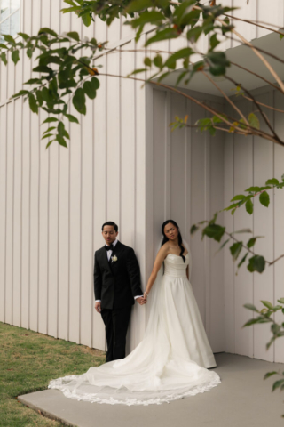 A bride and groom have a candid documentary elopement wedding ceremony in Houston, Texas at the Addison Woods Wedding Venue followed by modern classy bridal portraits and candid photos while interacting with their reception guests.