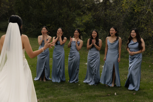 A bride and groom have a candid documentary elopement wedding ceremony in Houston, Texas at the Addison Woods Wedding Venue followed by modern classy bridal portraits and candid photos while interacting with their reception guests.