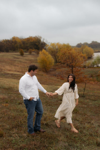 A young couple take their documentary and romantic engagement photos by a Texas DFW cinematic, moody, documentary style photographer.