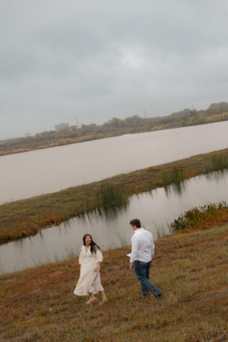 A young couple take their documentary and romantic engagement photos by a Texas DFW cinematic, moody, documentary style photographer.