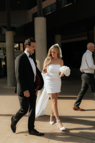 A bride and groom have a candid documentary elopement wedding ceremony in Dallas, Texas, followed by modern classy bridal portraits and candid photos while interacting with their reception guests.