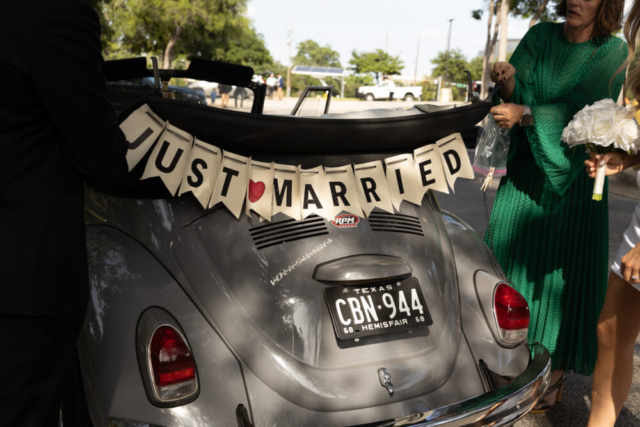 A bride and groom have a candid documentary elopement wedding ceremony in Dallas, Texas, followed by modern classy bridal portraits and candid photos while interacting with their reception guests.