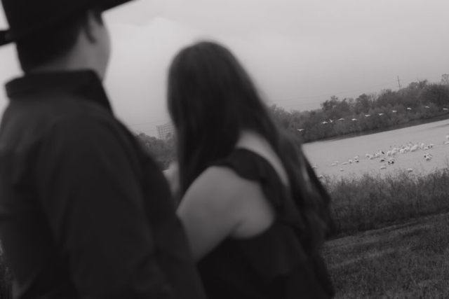 A young couple take their documentary and romantic engagement photos by a Texas DFW cinematic, moody, documentary style photographer.