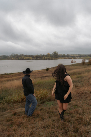 A young couple take their documentary and romantic engagement photos by a Texas DFW cinematic, moody, documentary style photographer.