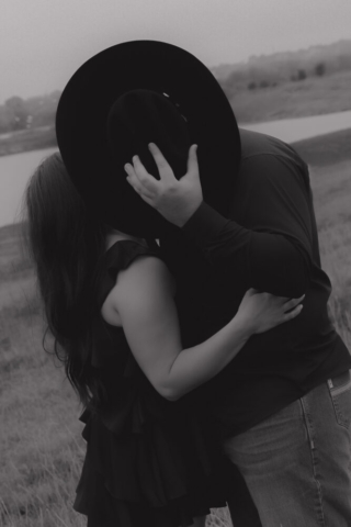 A young couple take their documentary and romantic engagement photos by a Texas DFW cinematic, moody, documentary style photographer.