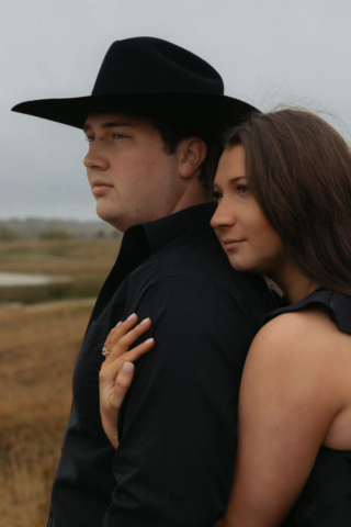 A young couple take their documentary and romantic engagement photos by a Texas DFW cinematic, moody, documentary style photographer.