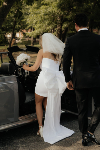 A bride and groom have a candid documentary elopement wedding ceremony in Dallas, Texas, followed by modern classy bridal portraits and candid photos while interacting with their reception guests.