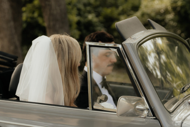 A bride and groom have a candid documentary elopement wedding ceremony in Dallas, Texas, followed by modern classy bridal portraits and candid photos while interacting with their reception guests.