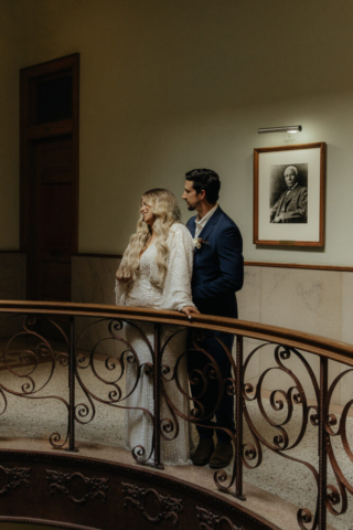 A young bride and groom at the Tarrant County Courthouse and Fort Worth Stockyards on their intimate elopement wedding day in Fort Worth, Texas.