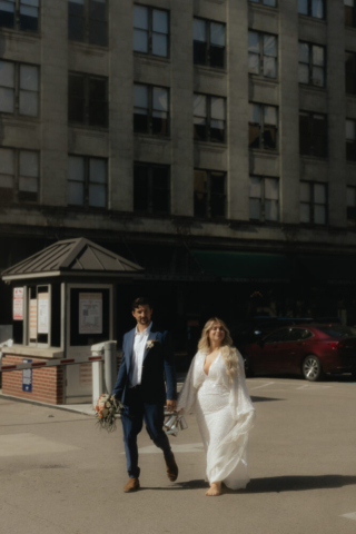 A young bride and groom at the Tarrant County Courthouse and Fort Worth Stockyards on their intimate elopement wedding day in Fort Worth, Texas.