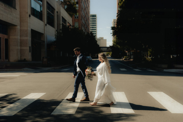 A young bride and groom at the Tarrant County Courthouse and Fort Worth Stockyards on their intimate elopement wedding day in Fort Worth, Texas.