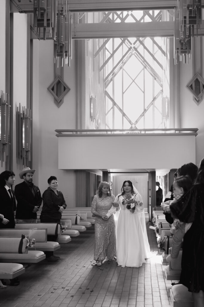 A young couple has their intimate wedding at the Marty Leonard Chapel in Fort Worth, Texas by a Texas DFW documentary wedding photographer ( Hannah Lylene Photography) A young couple has their intimate wedding at the Marty Leonard Chapel in Fort Worth, Texas by a Texas DFW documentary wedding photographer ( Hannah Lylene Photography)