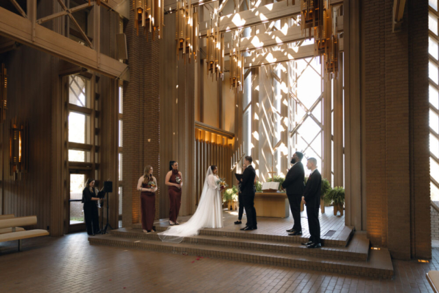 A young couple has their intimate wedding at the Marty Leonard Chapel in Fort Worth, Texas by a Texas DFW documentary wedding photographer ( Hannah Lylene Photography)