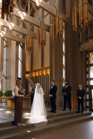 A young couple has their intimate wedding at the Marty Leonard Chapel in Fort Worth, Texas by a Texas DFW documentary wedding photographer ( Hannah Lylene Photography)