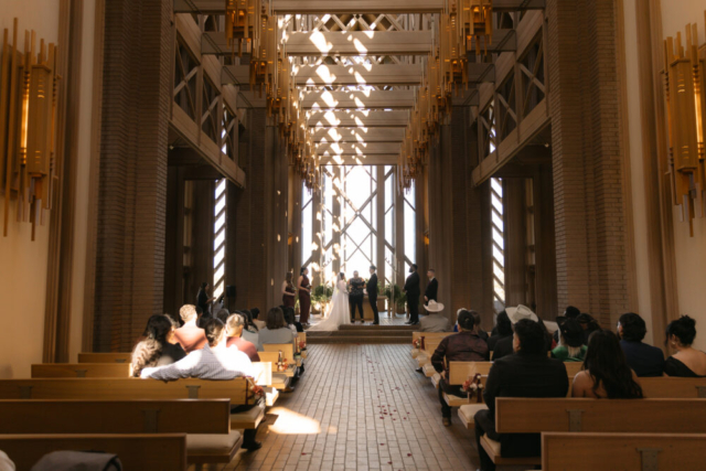 A young couple has their intimate wedding at the Marty Leonard Chapel in Fort Worth, Texas by a Texas DFW documentary wedding photographer ( Hannah Lylene Photography)