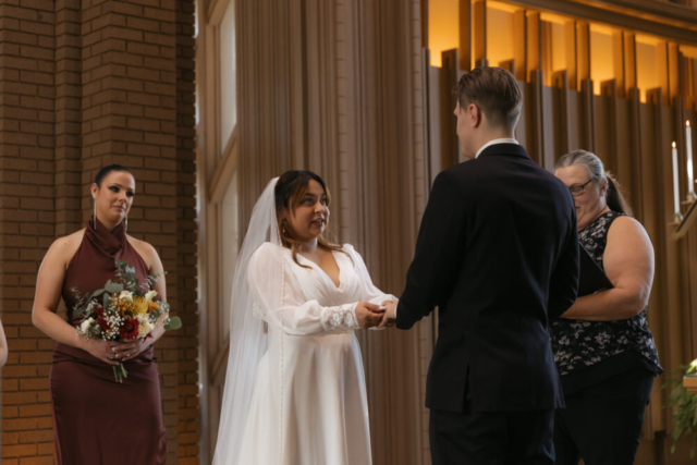 A young couple has their intimate wedding at the Marty Leonard Chapel in Fort Worth, Texas by a Texas DFW documentary wedding photographer ( Hannah Lylene Photography)