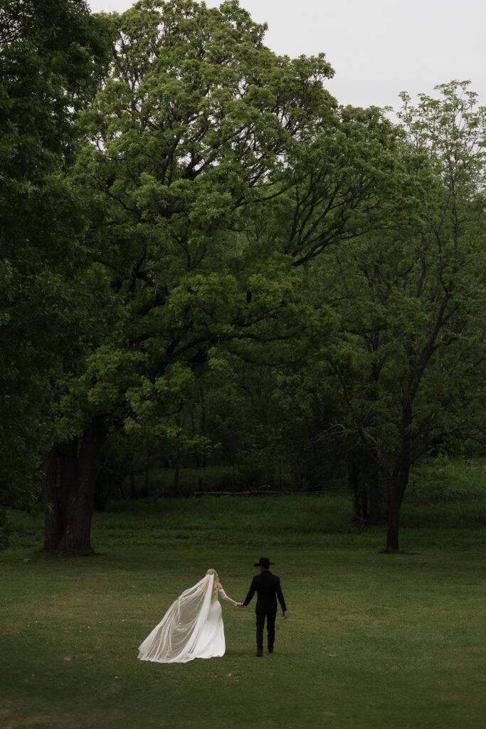 True-to-color, cinematic documentary-style wedding photos from a real Texas wedding at HR Ranch. Captured by a DFW wedding photographer, featuring rustic charm and candid moments.